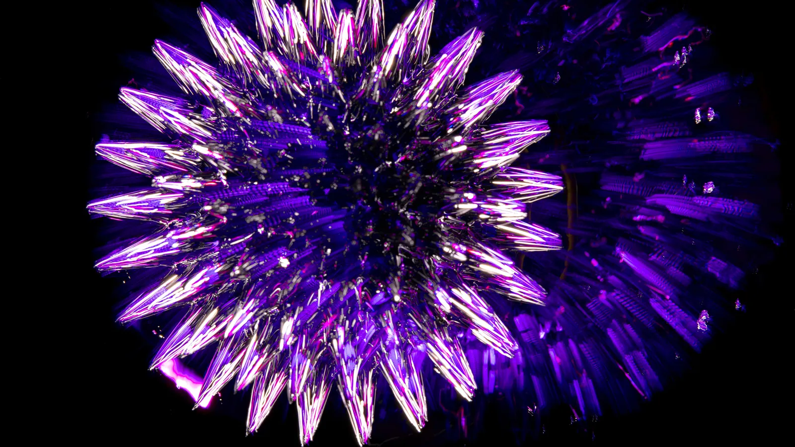 Purple crystalline form glowing against a black background