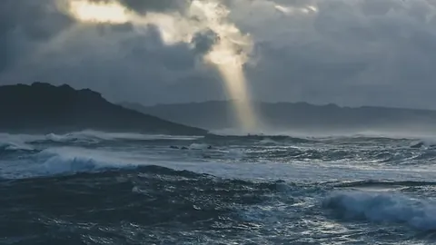 Magnificent waves of the stormy ocean captured on a cloudy evening
