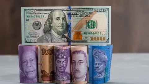 Assorted currency bills on plaster and wooden table