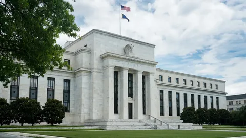 The Federal Reserve building in Washington under a cloudy sky