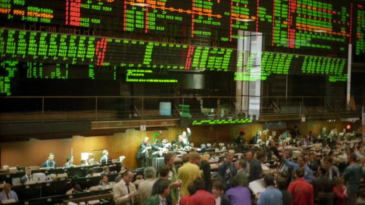 Traders below electronic price boards on the floor of a Chicago commodity exchange