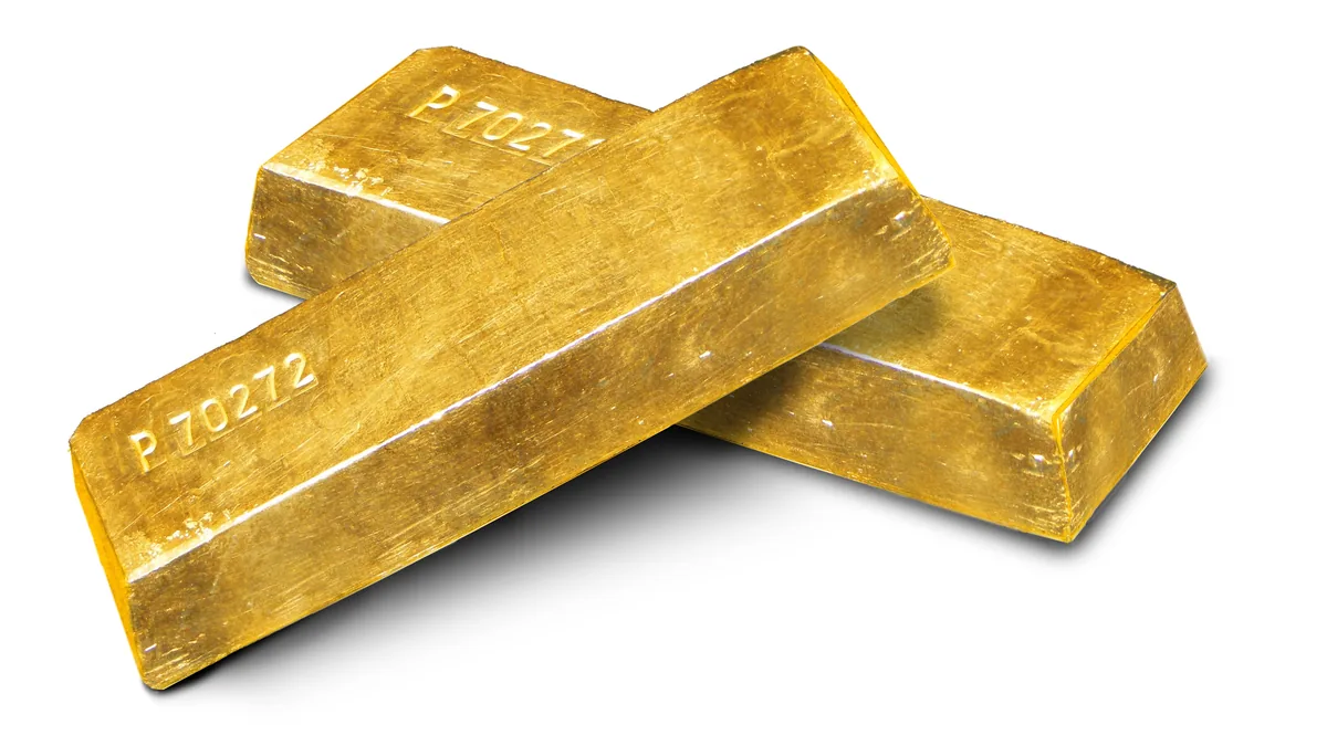 Two cast gold ingots on a white background
