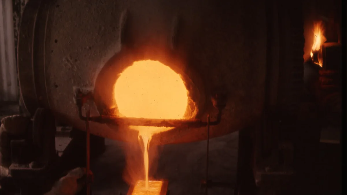 Molten gold being poured into an ingot mould at a mine
