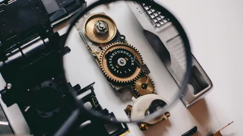 Magnifying glass over the gears of a small mechanism