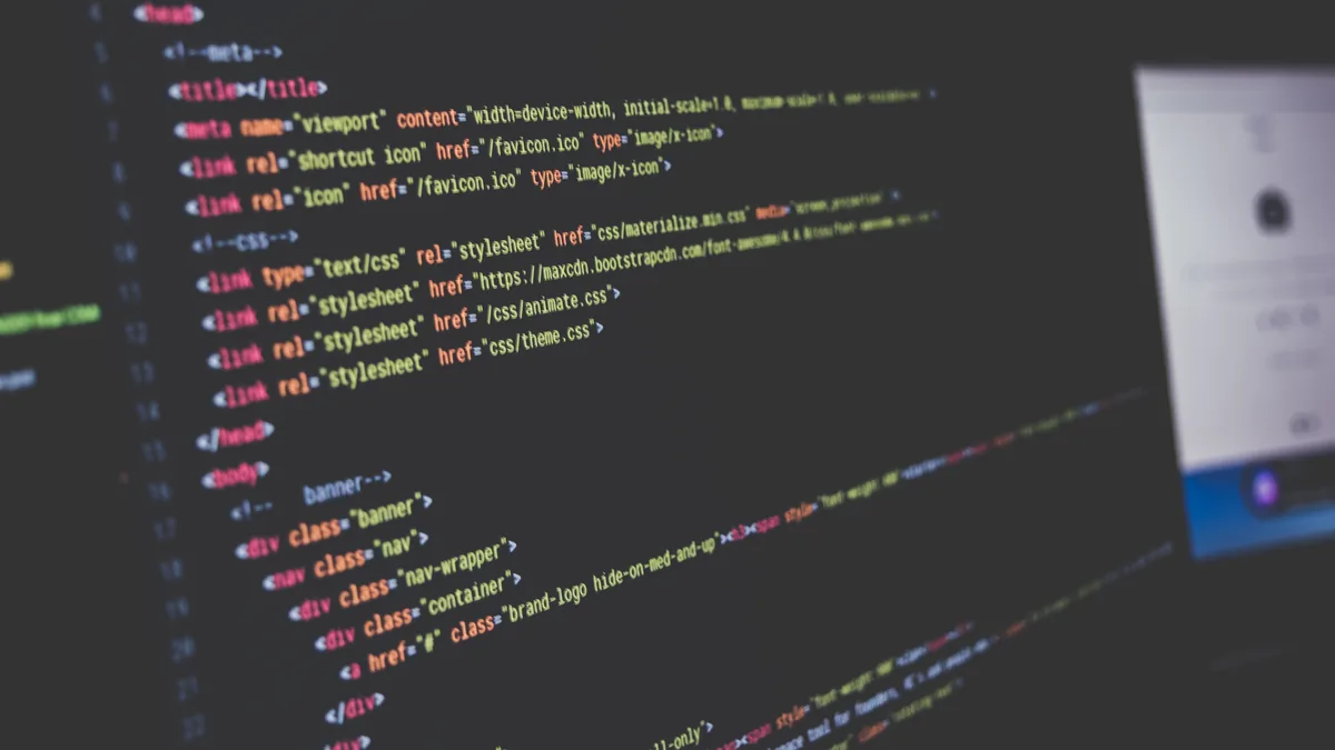 Colour-highlighted program code on a dark computer screen