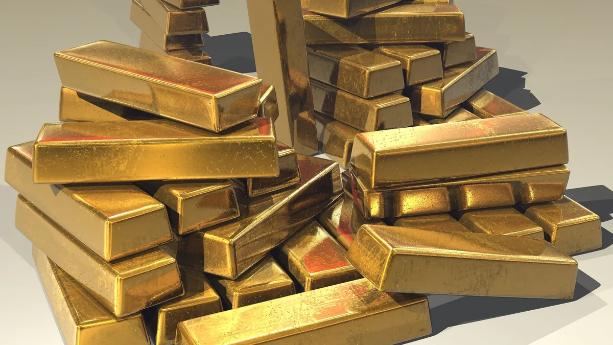 A pile of stacked gold bullion bars