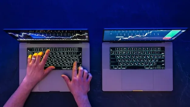 Man working on two laptops stock market trading investments top view