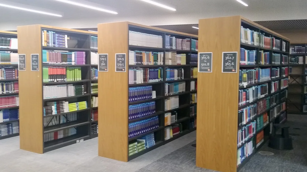 Rows of library shelves filled with books