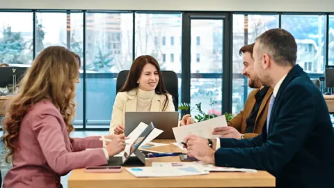 Business team meeting around a table in an office