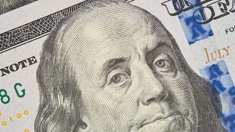 Portrait of Franklin on a hundred dollar bill Closeup of one hundred US dollars banknotes selective focus Business finance concept business news splash screen banner mockup